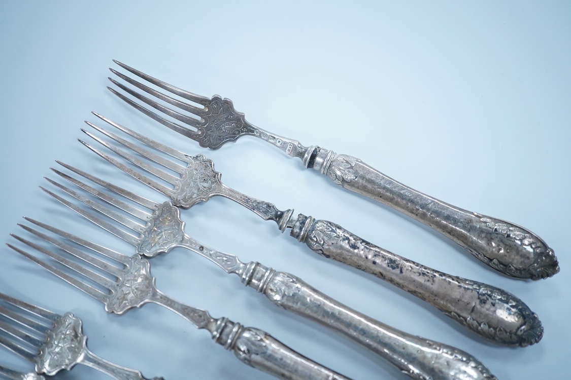 Eight Victorian silver fish forks and seven fish knives, by Hilliard & Thomason, Birmingham, 1878, with loaded unmarked white metal handles, one a plated replacement.